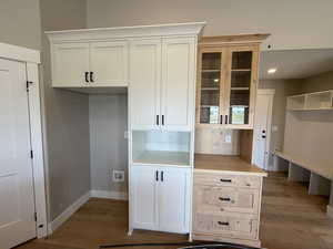 Mudroom featuring light wood finished floors and recessed lighting