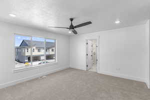Unfurnished room featuring carpet floors, ceiling fan, recessed lighting, and a textured ceiling