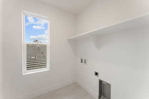 Laundry area with washer hookup and hookup for an electric dryer