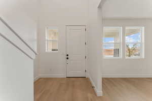 Entryway featuring light wood finished floors and baseboards