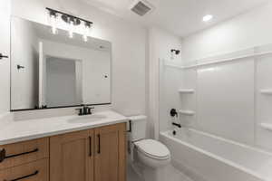 Bathroom featuring  shower combination and vanity