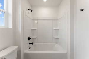 Full bathroom with bathtub / shower combination