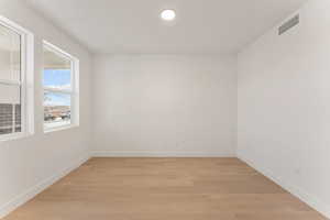 Spare room with light wood-style flooring and recessed lighting