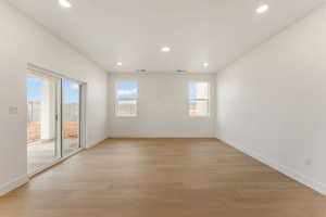 Spare room with recessed lighting and light wood-style floors