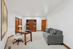 Office area featuring light carpet and recessed lighting