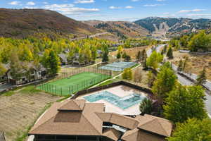 Drone / aerial view of mountains and a pool area