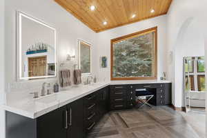 Full bath with recessed lighting, double vanity, healthy amount of natural light, and wooden ceiling