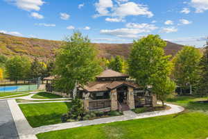 View of home's community with a porch and a mountain view