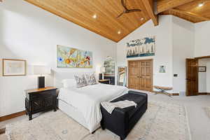 Bedroom featuring carpet, high vaulted ceiling, recessed lighting, and a wood ceiling with exposed beams