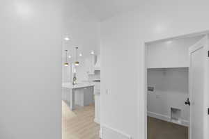 Hallway featuring recessed lighting and light wood-type flooring