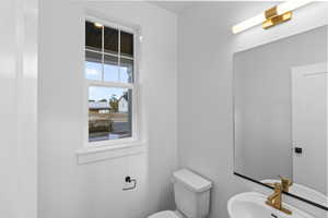 Bathroom with toilet and a sink