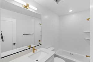 Bathroom featuring vanity and shower / bath combination