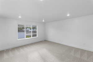Loft featuring light carpet and recessed lighting