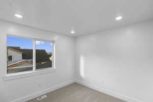 Carpeted bedroom 2 with recessed lighting