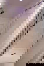 Full bathroom with a shower stall