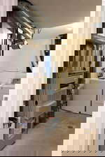 Laundry area with separate washer and dryer, heating unit, and water heater