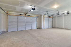 Garage featuring a garage door opener