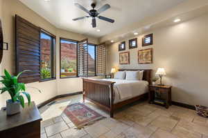 Bedroom featuring stone tile floors, recessed lighting, and a ceiling fan