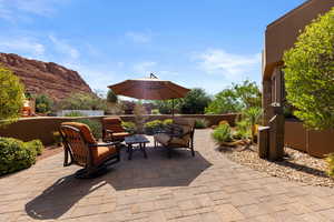 View of patio with a mountain view and outdoor lounge area