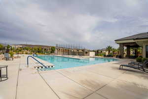 Community pool featuring a patio area