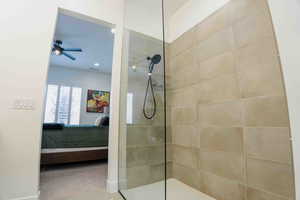 Full bath with ensuite bathroom, a walk in shower, ceiling fan, and recessed lighting