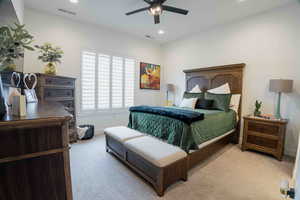 Bedroom with recessed lighting, ceiling fan, and light colored carpet