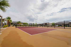View of tennis court featuring community basketball court