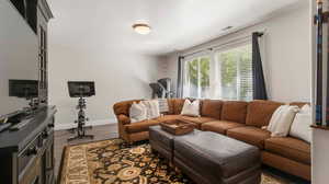 Basement Living area with large walk-in closet- could easily be converted to 6th bedroom if desired but currently open to basement entertaining rooms.