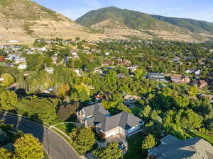 View of property location featuring mountains and a tree filled landscape