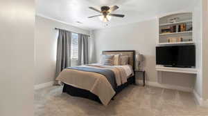 Bedroom with light colored carpet, ceiling fan, and a textured ceiling