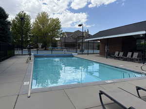 Community pool with a patio area