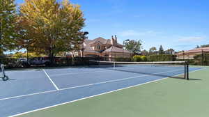 View of community tennis court conveniently located across the street