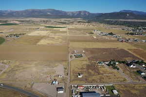 View of property location featuring a mountain backdrop and rural landscape
