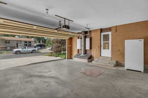 Garage featuring a garage door opener