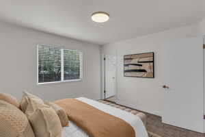 Carpeted bedroom with baseboards