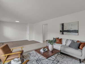 Living room with baseboards and tile patterned flooring