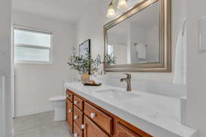 Bathroom with vanity and light tile patterned floors