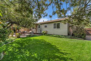 Rear view of property with a patio area