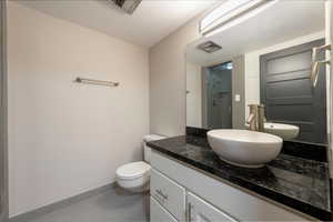 Bathroom with a shower stall and vanity