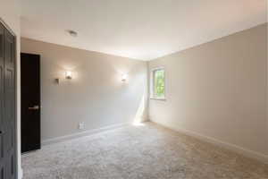 Spare room with carpet flooring and baseboards