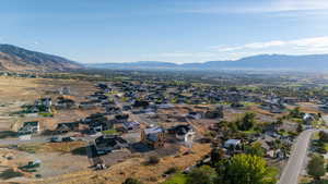Aerial view of property's location featuring nearby suburban area