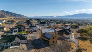 Aerial perspective of suburban area with a mountainous background