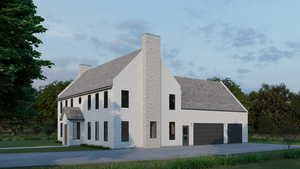 View of side of property featuring a chimney, concrete driveway, and roof with shingles