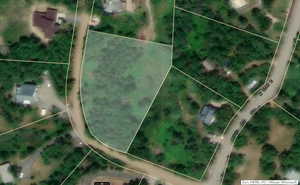 Aerial map of property and surrounding area with property boundaries highlighted