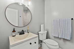 Bathroom featuring vanity and toilet