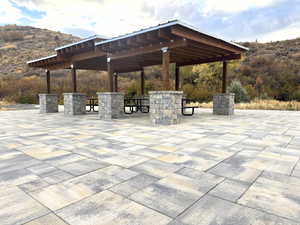 View of community with a patio area, mail area, a mountain view, and a pergola