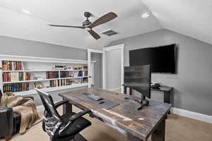 Office space featuring light carpet, ceiling fan, lofted ceiling, and recessed lighting