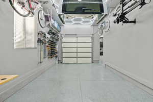 Garage featuring baseboards