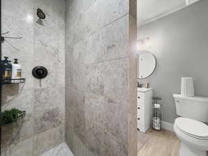 Bathroom with vanity and a tile shower