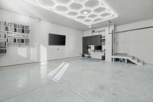 Garage featuring baseboards